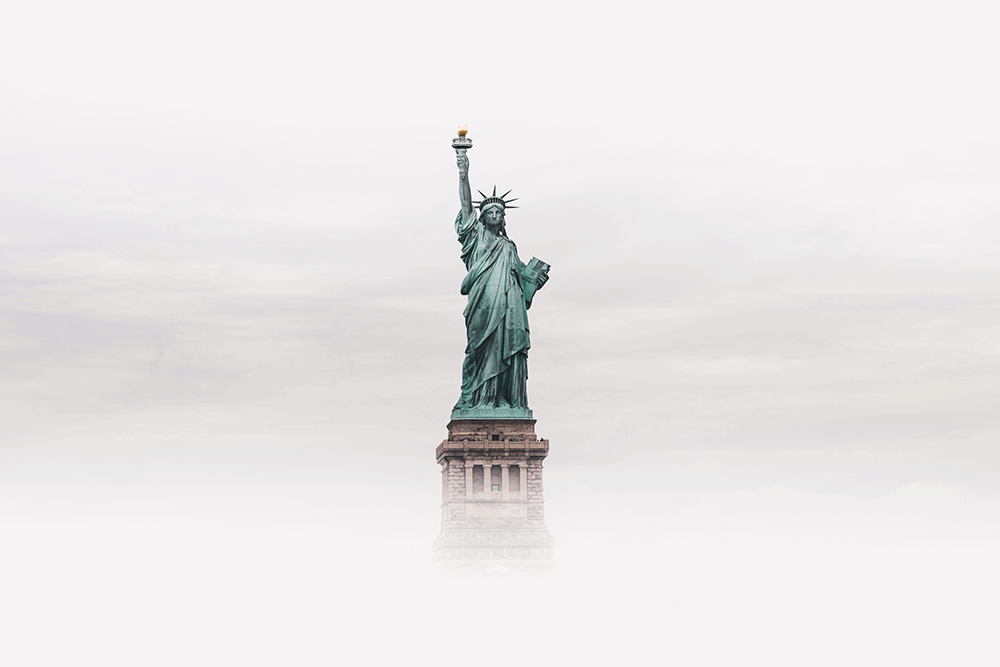 Presidential Proclamations: Entry Ban to the United States and National Interest Exceptions, image of the statue of liberty with fog around it