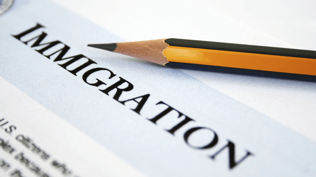 Immigration Attorney, image of Immigration written on paper.