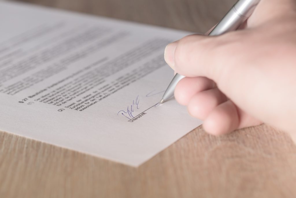 The Importance of a Custom-Drafted Operating Agreement, image of a contract.