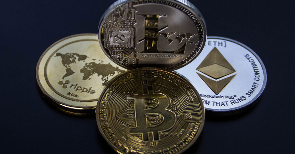 Can Cryptocurrency Be Used as a Source of Funds to Invest in the U.S?, image of crypto coins stacked on a table.